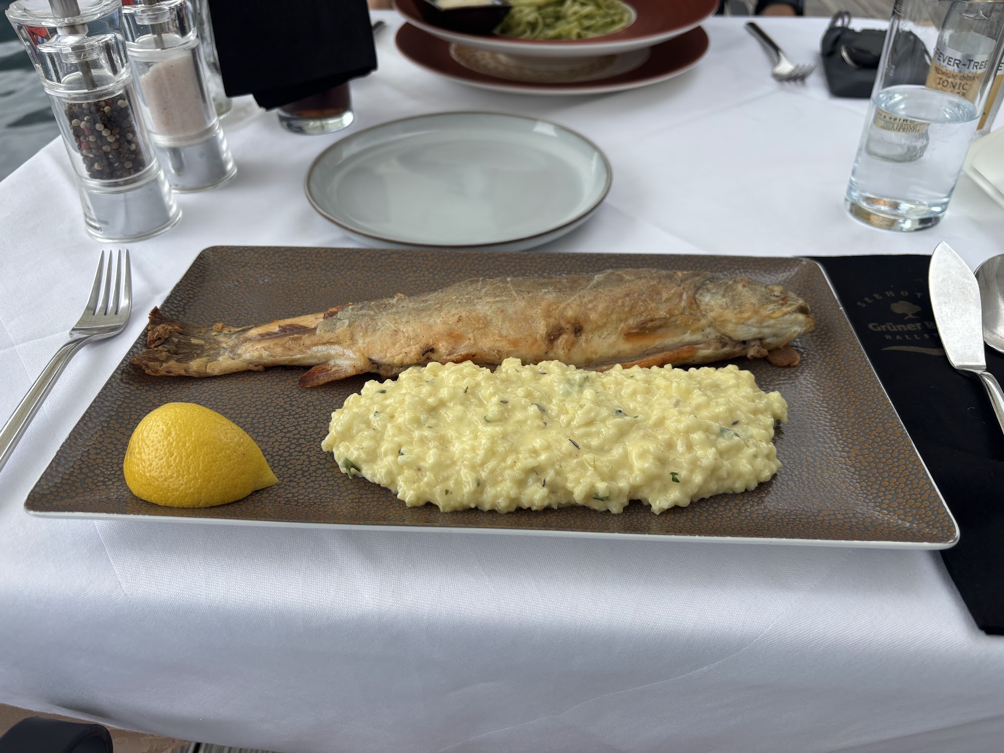 Whole fish dish with risotto at Restaurant Grüner Baum