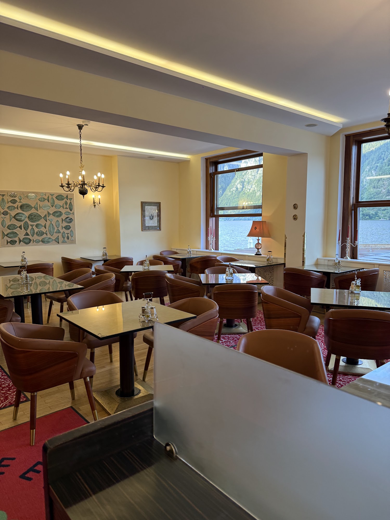 Indoor dining room with windows facing Lake Hallstatt