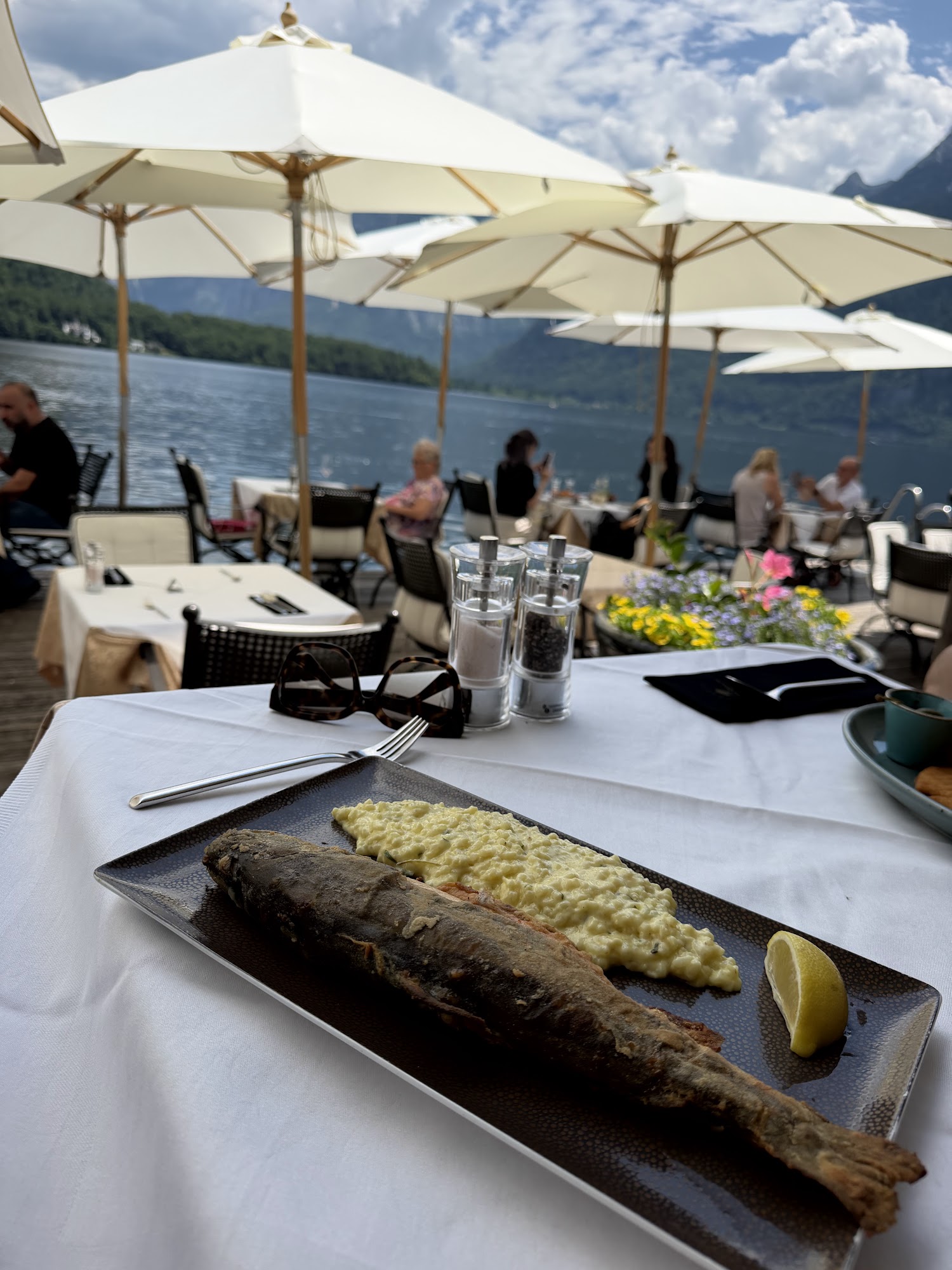 Whole fish served on the terrace with the lake in view
